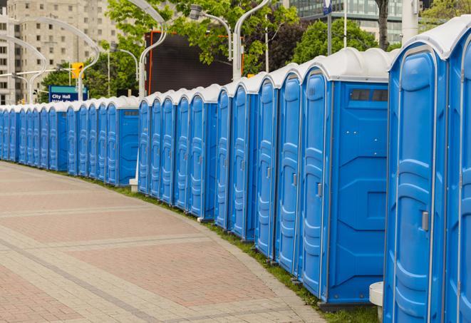 a row of portable restrooms at an outdoor special event, ready for use in Chatsworth